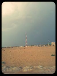 Lighthouse against cloudy sky