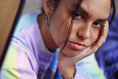 Close-up of girl sitting at home