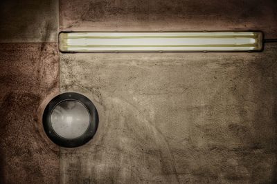 Close-up of electric lamp on table at home