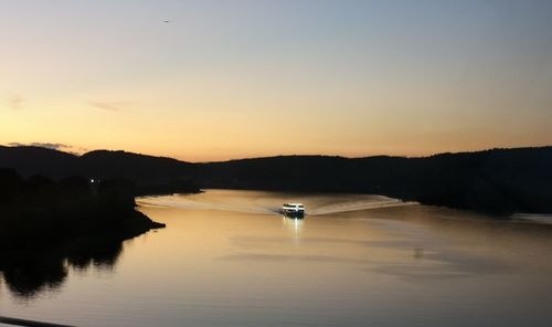 Scenic view of lake against sky during sunset