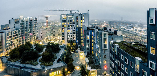 High angle view of illuminated buildings against sky