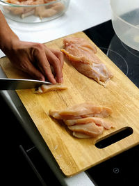 High angle view of person preparing food on cutting board