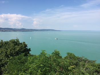 Scenic view of sea against cloudy sky