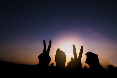 Silhouette of hands gesture v sign and fist power for victory/peace. success and winner in 2020.