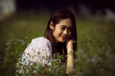 Portrait of a smiling young woman outdoors