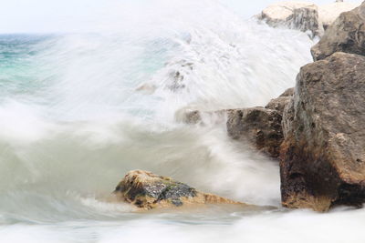 Scenic view of rocks in sea