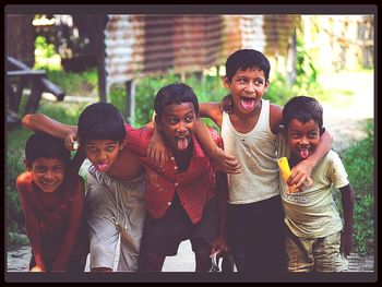 Portrait of happy boy playing