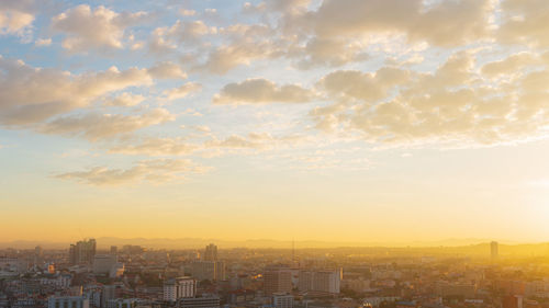 High angle view of buildings against sky during sunset