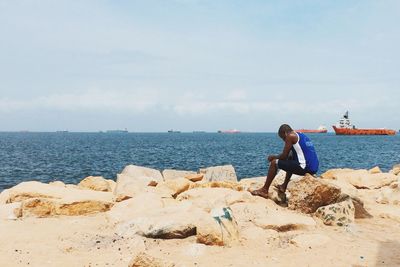 Woman standing on beach