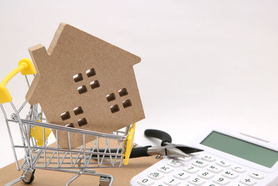 High angle view of electric lamp on table against white background