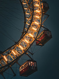 Low angle view of illuminated bridge against sky at night