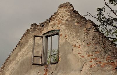 Low angle view of old building against sky