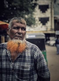 Portrait of man looking at camera