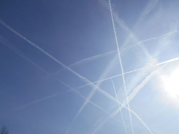 Low angle view of vapor trail in blue sky