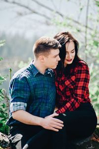 Loving young couple in forest