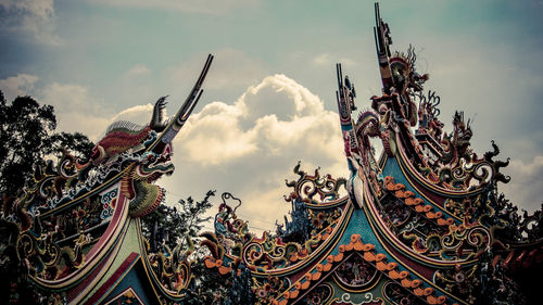 Low angle view of sculpture against sky