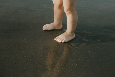 Low section of child on beach