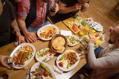 Group of people having meal in restaurant