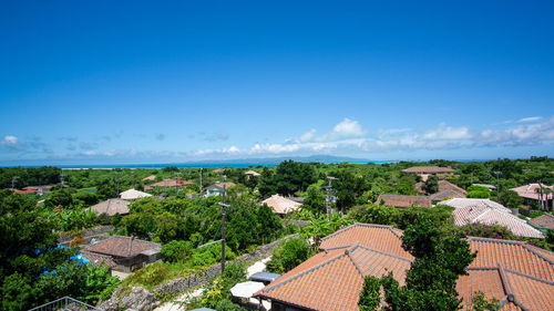 High angle view of townscape against blue sky