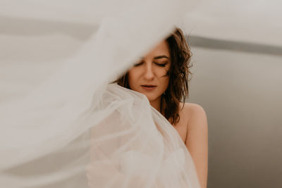 Portrait of young woman looking away