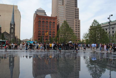 Group of people in front of buildings