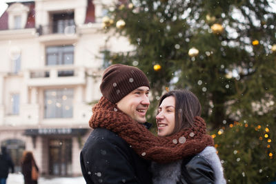 Portrait of smiling young woman in winter