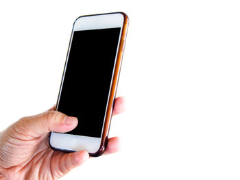 Close-up of hand holding smart phone over white background