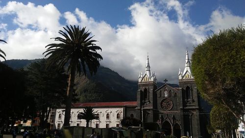 Low angle view of church against cloudy sky