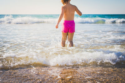 Woman standing on beach