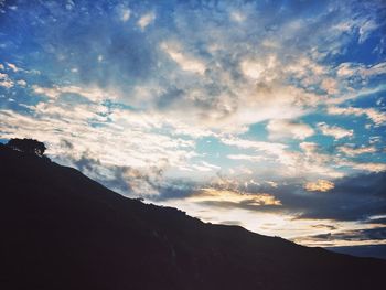 Low angle view of silhouette mountain against sky