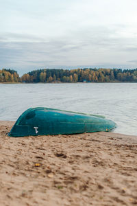 Boat on the sandy river bank. forest in the background