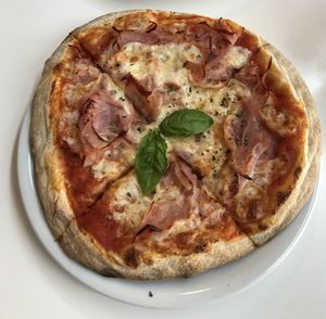 High angle view of pizza in plate on table