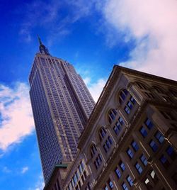 Low angle view of building against cloudy sky