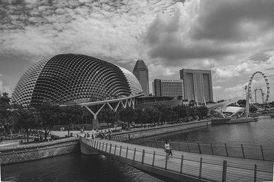 Buildings against cloudy sky