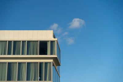 Low angle view of building against blue sky