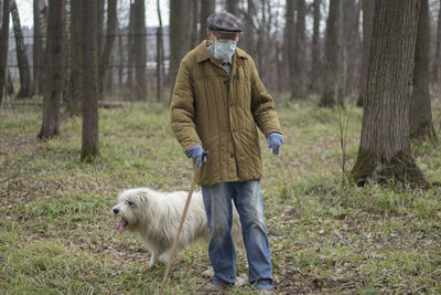 Man with dog in the forest
