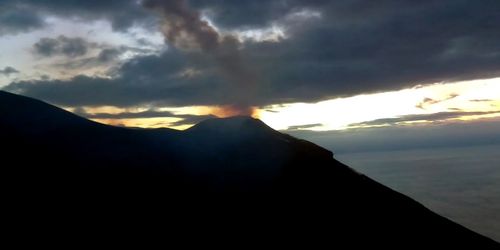 Scenic view of silhouette mountain against sky during sunset