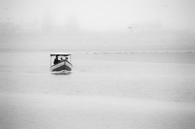 Boat in sea against sky