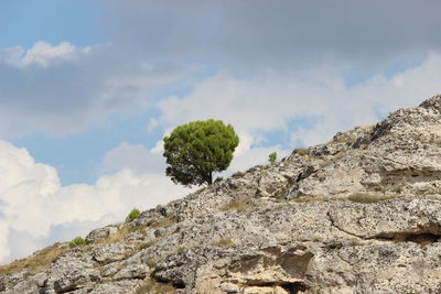 Low angle view of rock against sky