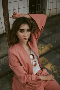 Portrait of beautiful young woman standing outdoors