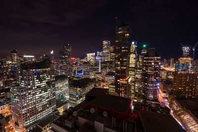 High angle view of city lit up at night