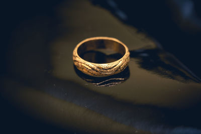 Close-up of wedding rings on metal