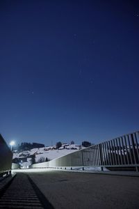 Scenic view of city against blue sky at night