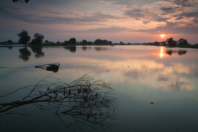 Scenic view of lake against sky during sunset