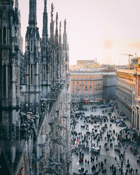 Crowd on city street with buildings in background