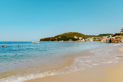 Scenic view of sea against clear blue sky