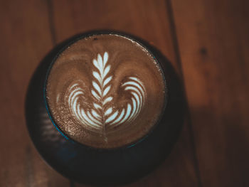 Close-up of cappuccino served on table