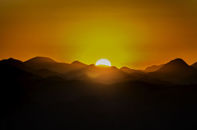 Scenic view of mountains against sky during sunset