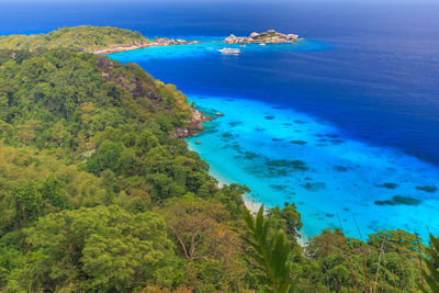 High angle view of bay against clear blue sky