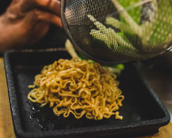 Close-up of person preparing food